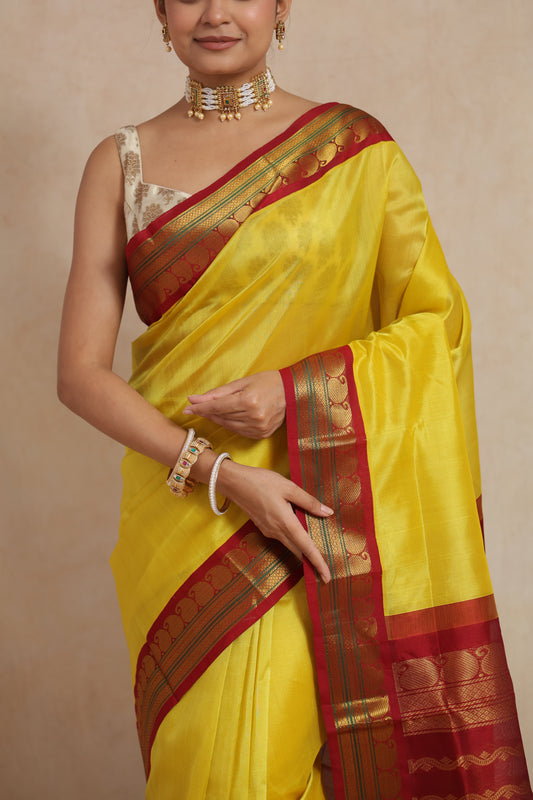 Front view of Sunshine Yellow Gadwal Silk Saree with maroon zari woven border