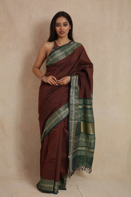 Deep maroon Kanchipuram handloom cotton saree with green woven border and traditional motifs