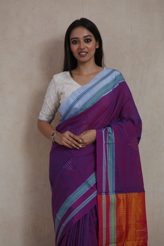 Close-up of royal purple Ilkal cotton saree with woven border and handcrafted details