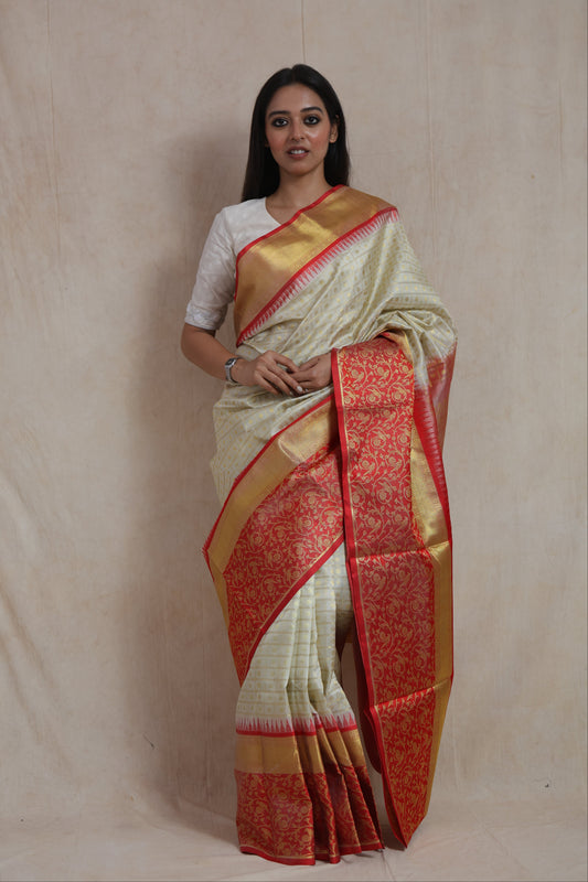Venkatagiri silk saree with coral red and golden woven border, rich pallu, showcasing intricate traditional craftsmanship.