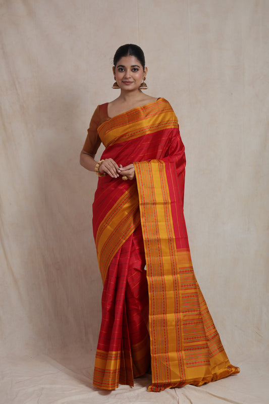 Full drape view of crimson red Kanchipuram silk saree with elegant striped weave