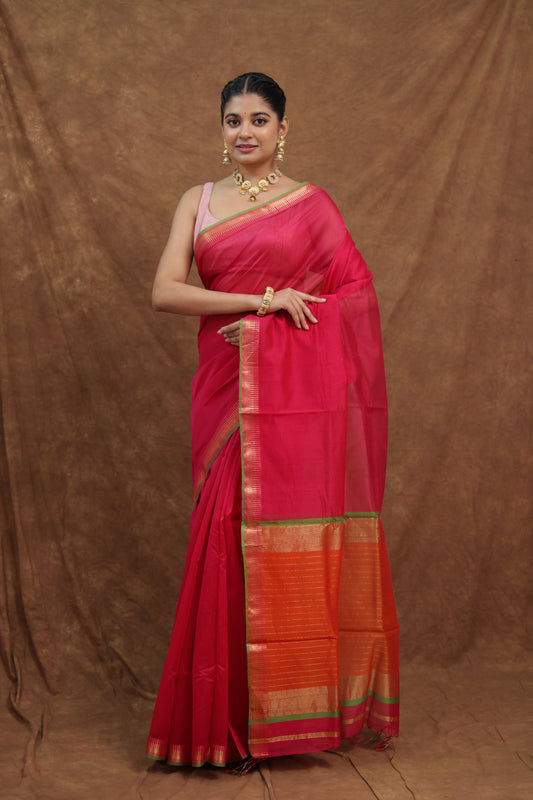 Pink Maheshwari SICO saree with rust orange pallu from Joyee Kolkata, featuring intricate traditional weave and elegant draping.