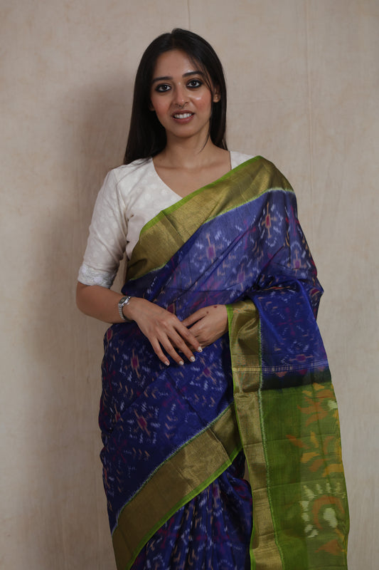 Front view of royal indigo Panchampali handloom silk cotton saree with contrast green pallu