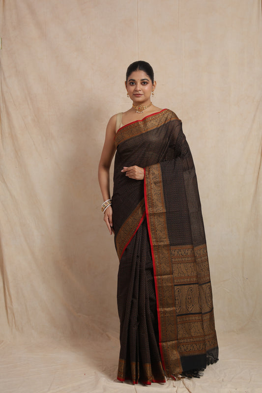 Front view of black Kanchipuram cotton saree with woven border