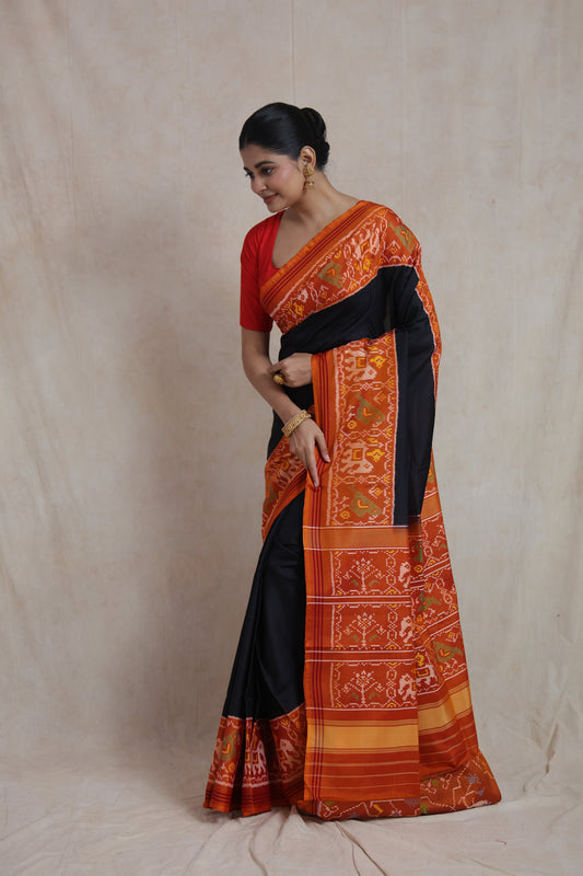 Full pallu display of black Patola silk saree with elephant motifs