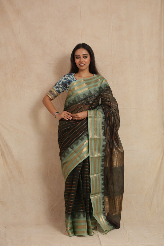 Front view of black Kanchipuram cotton saree with mint green woven border