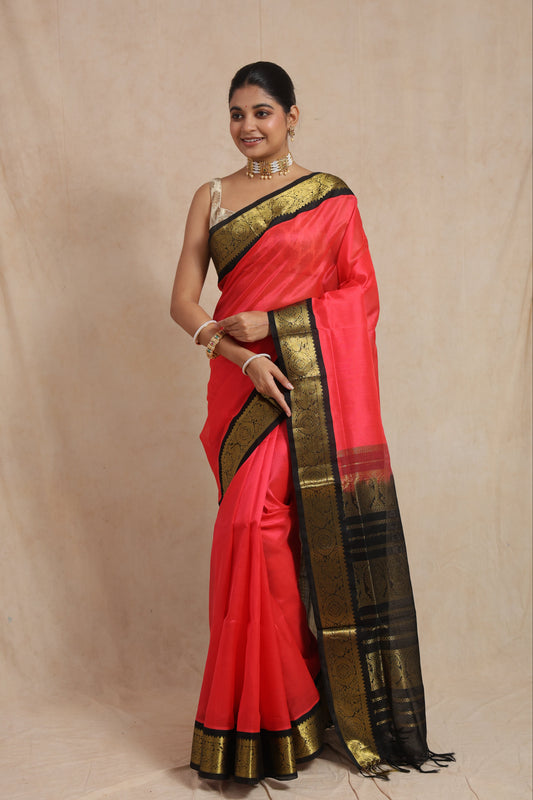Traditional festive look featuring coral pink Kanchipuram Sico saree with contrast pallu