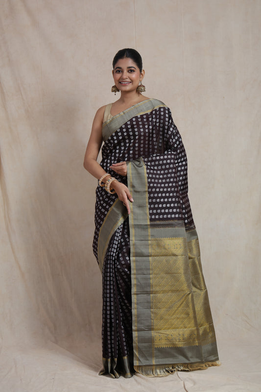 Front view of deep brown Kanjivaram silk saree with silver woven buttas