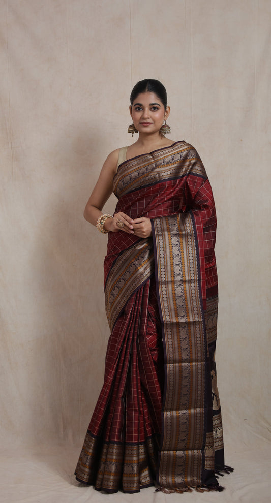Front view of deep wine Kanjeevaram silk saree with antique zari woven border