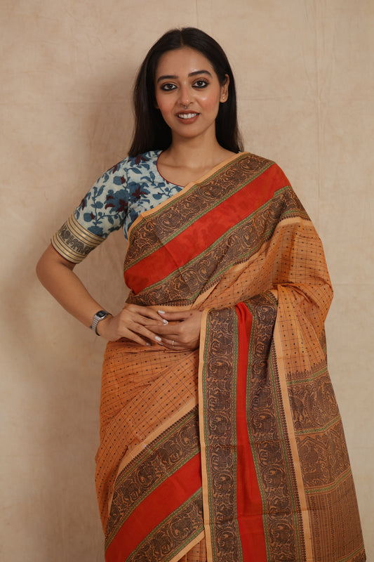 Portrait view of beige Kanchipuram cotton saree with traditional woven design