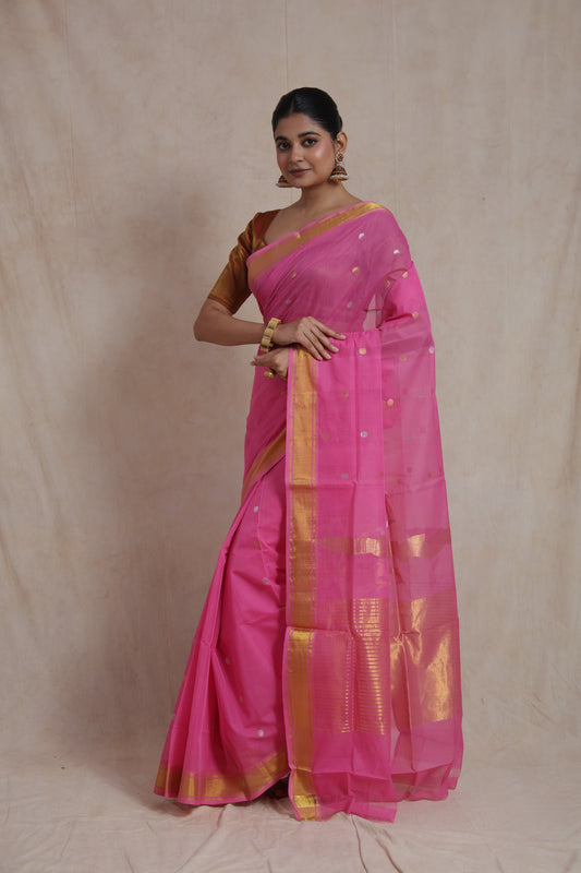 Model wearing pink Kanchipuram cotton saree with zari buttas