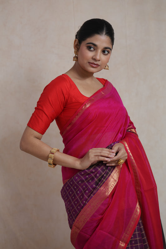 Close-up of pink Kanchipuram Sico saree with woven border detailing