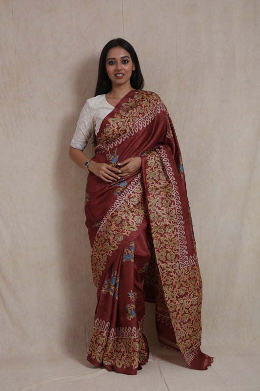 Portrait view of rust brown Batik silk saree with traditional handcrafted detailing