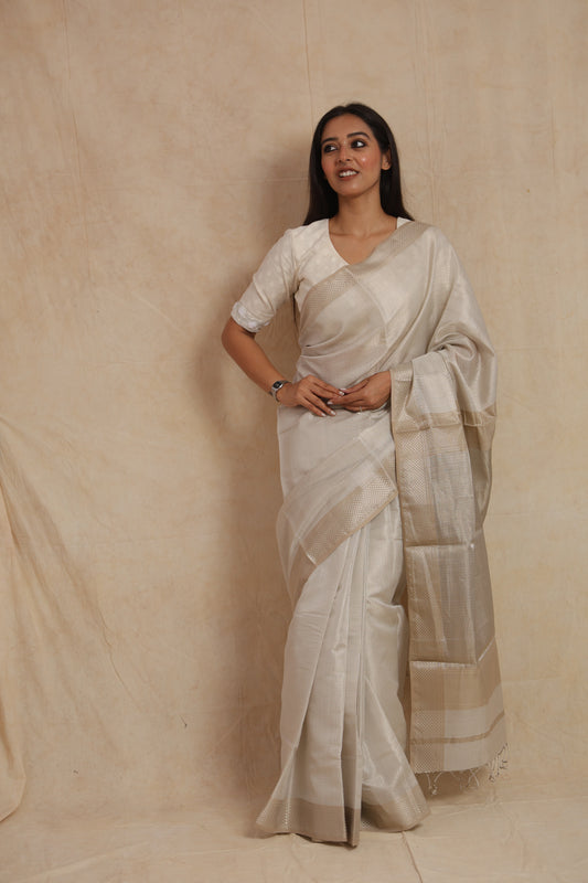 Full-length look of pearl white Maheshwari silk saree with subtle sheen