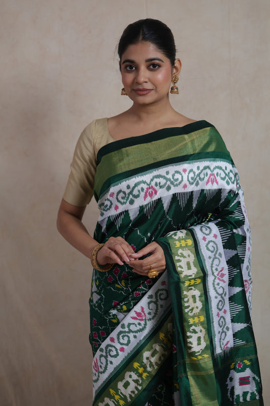 Portrait style image of emerald green Panchampali Silk saree with traditional motifs