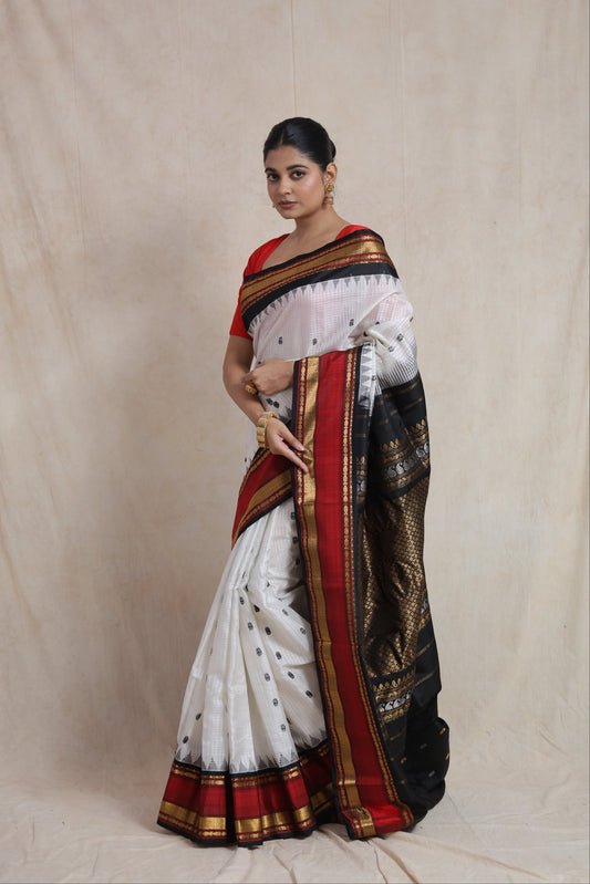 Handwoven white Gadwal silk saree with black zari pallu front view