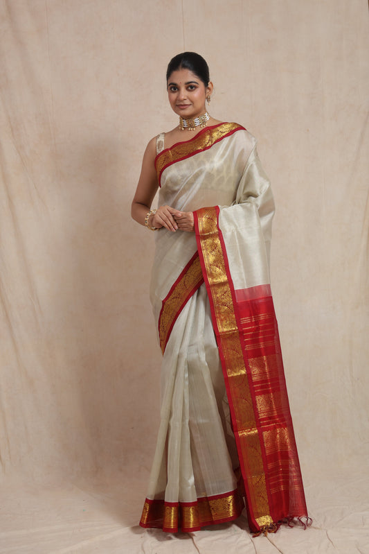 Full view of ivory Kanchipuram Sico saree with crimson red zari border
