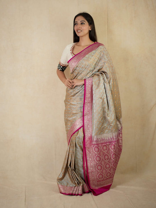 Grey semi Benarasi silk saree with intricate patterns and matching blouse piece, traditional Indian attire by Joyee Kolkata.