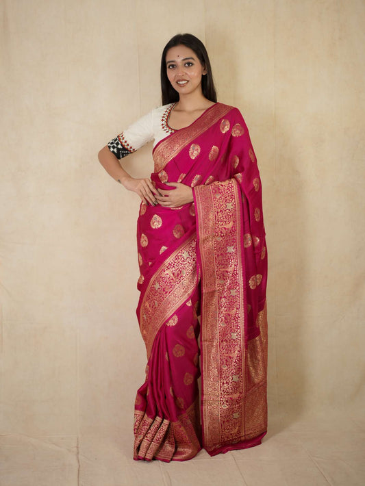 Magenta semi-silk Benarasi saree with intricate gold zari work and matching blouse piece, traditional Indian attire by Joyee Kolkata.