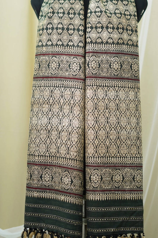 Green eri stole by Joyee Kolkata, showcasing soft fabric and traditional design, ideal for festive or elegant wear.