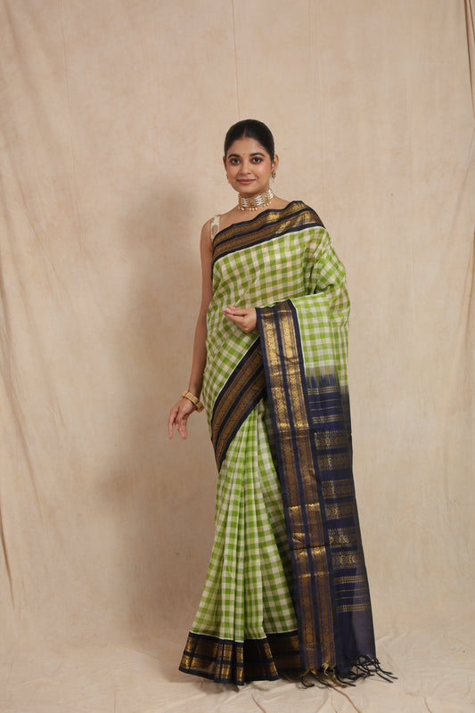 Front look of handwoven lime green checked Kanchipuram Sico saree with traditional woven detailing