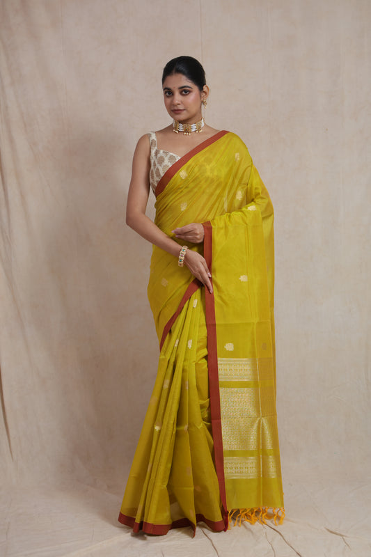 Front view of lime yellow Kanchipuram Sico saree with elegant zari detailing