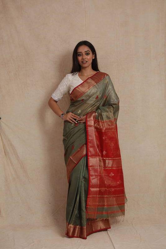 Full drape view of olive green Maheshwari silk cotton saree with elegant woven motifs