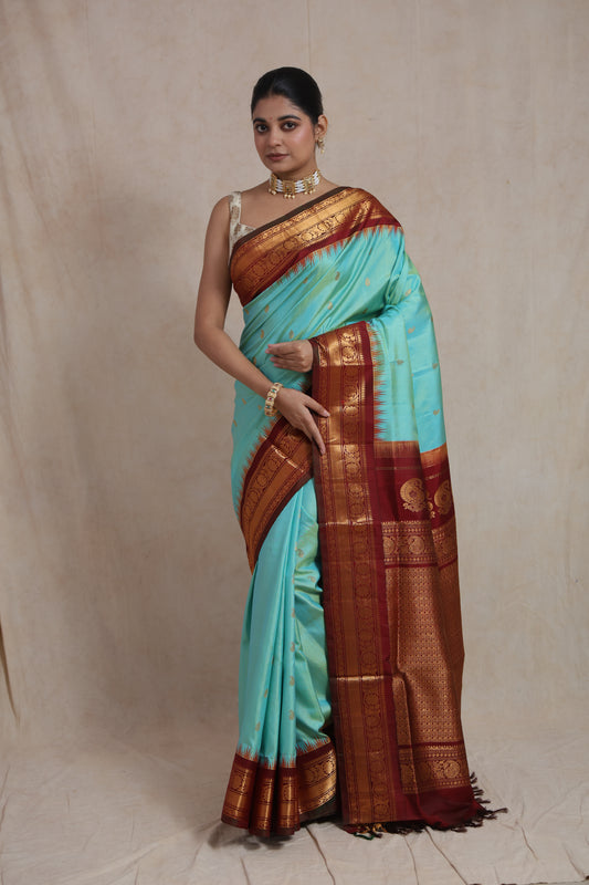Mint green Gadwal silk saree with rich maroon zari woven pallu