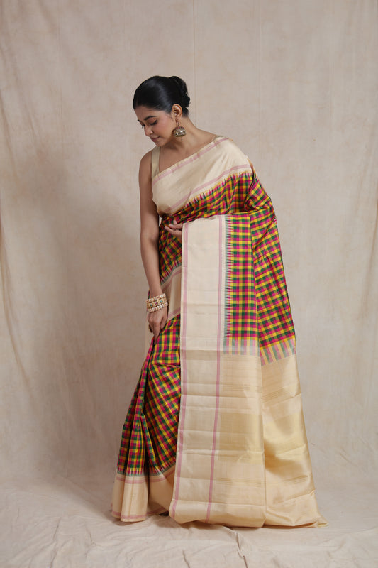 Graceful drape of ivory Kanjivaram silk saree with colorful checked pattern and traditional woven detailing