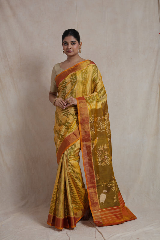 Elegant pose in mustard yellow Patola silk saree with rust orange border