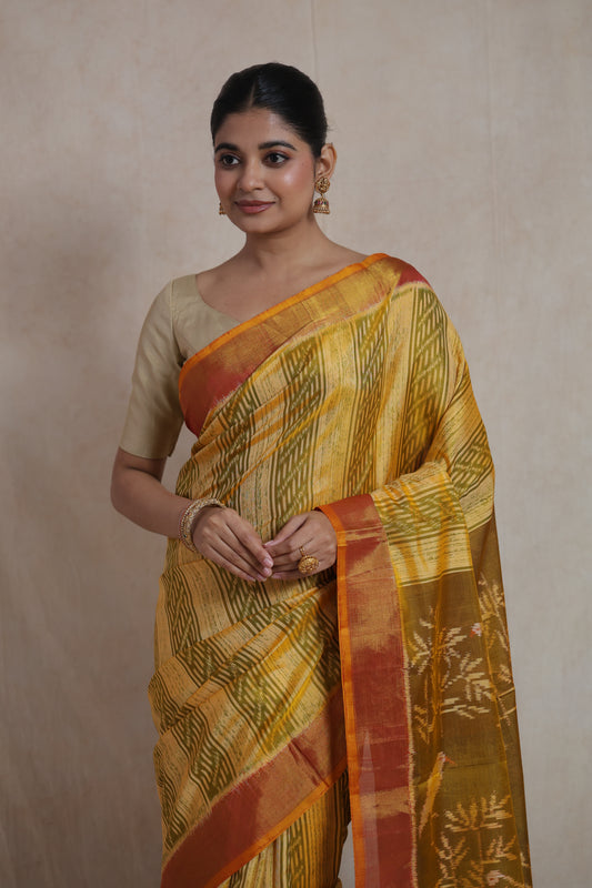Front view of mustard yellow Patola silk saree with geometric woven patterns