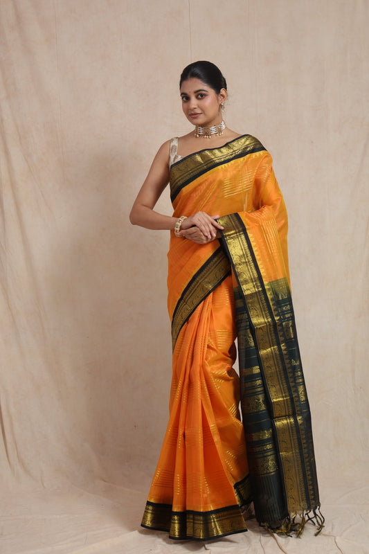 Full view of orange Kanchipuram Sico saree with black zari border