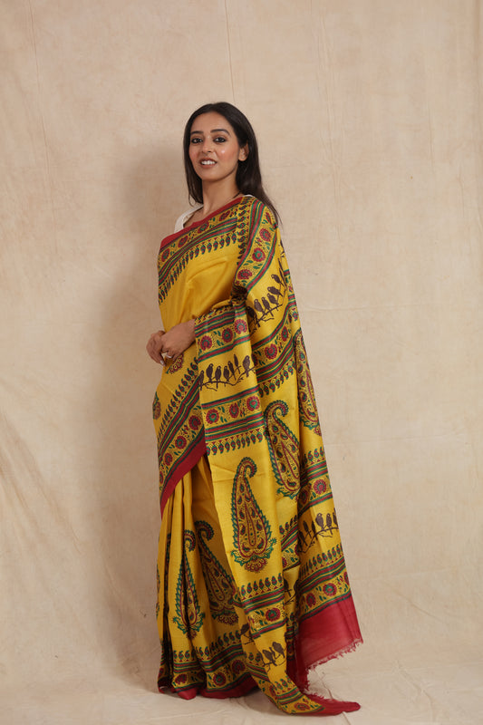 Side profile of sunshine yellow Tussar saree with traditional multicolor borders