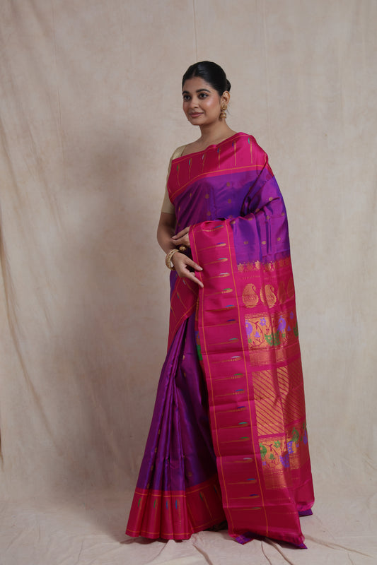 Elegant pose in royal purple Gadwal silk saree with pink zari border