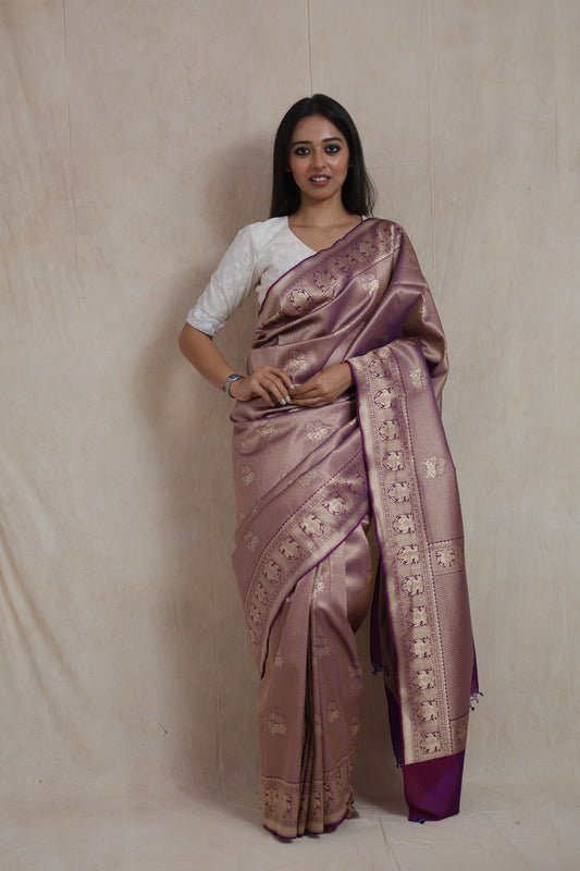 Front view of regal mauve Banarasi silk saree with woven elephant motifs and purple pallu