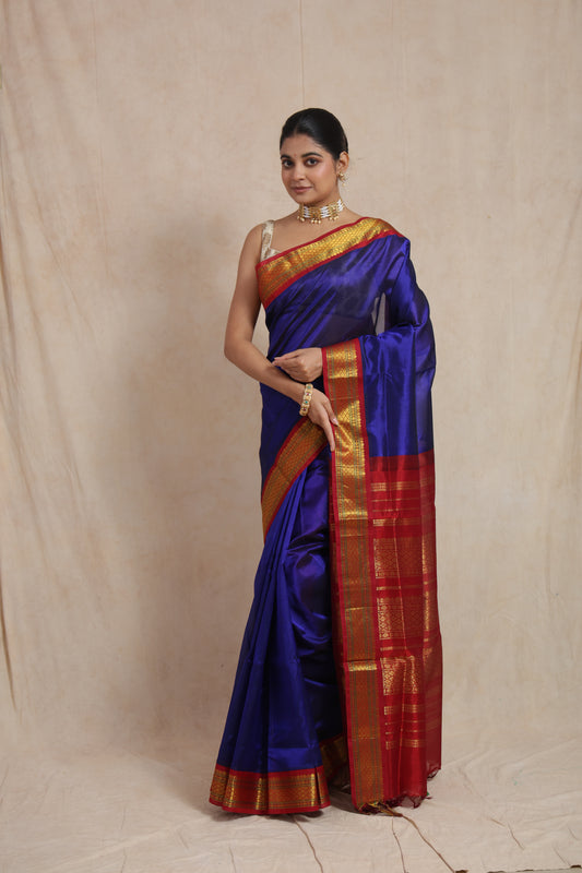 Full view of royal blue Kanchipuram Sico saree with rich red zari border