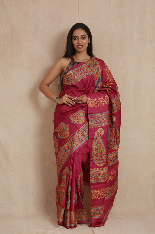 Royal magenta Tassar print saree with paisley motifs and decorative border