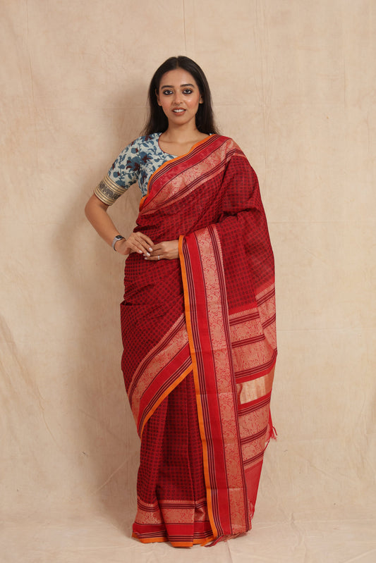 Full view of ruby red Kanchipuram cotton saree with detailed woven pallu
