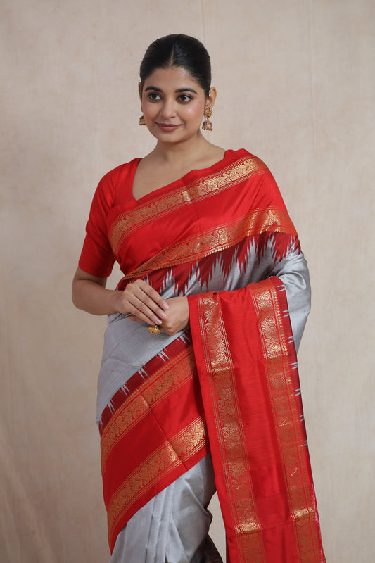 Traditional silver grey Panchampali silk saree with rich woven red border