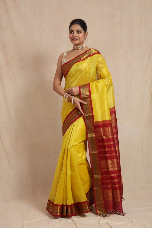 Full view of yellow Kanchipuram Sico saree with maroon zari border