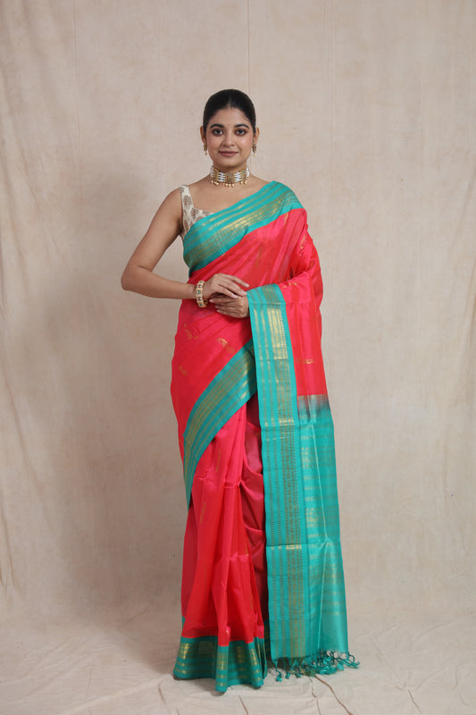 Front view of REDDISH Pink Kanchipuram Handloom SICO Saree with aqua blue border