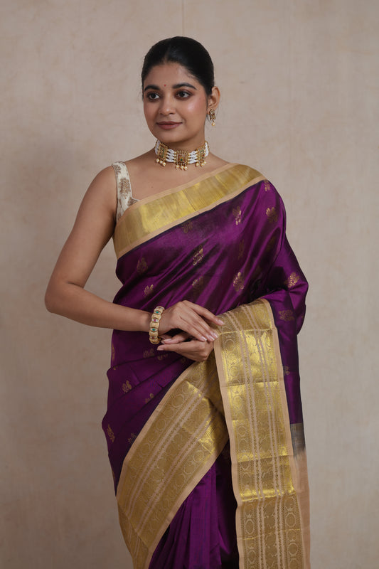 Front drape detail of royal purple Kanchipuram SICO saree highlighting woven buttas and elegant gold border