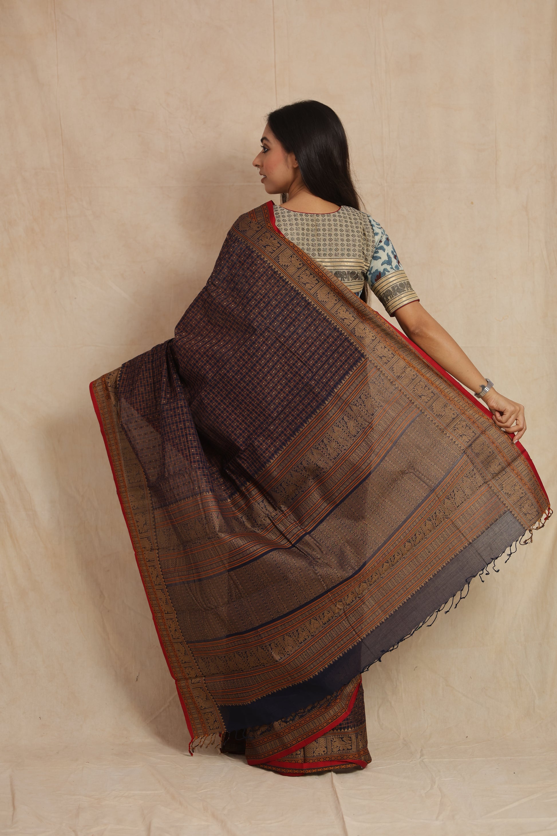 Back view of midnight blue handloom cotton saree showcasing detailed pallu