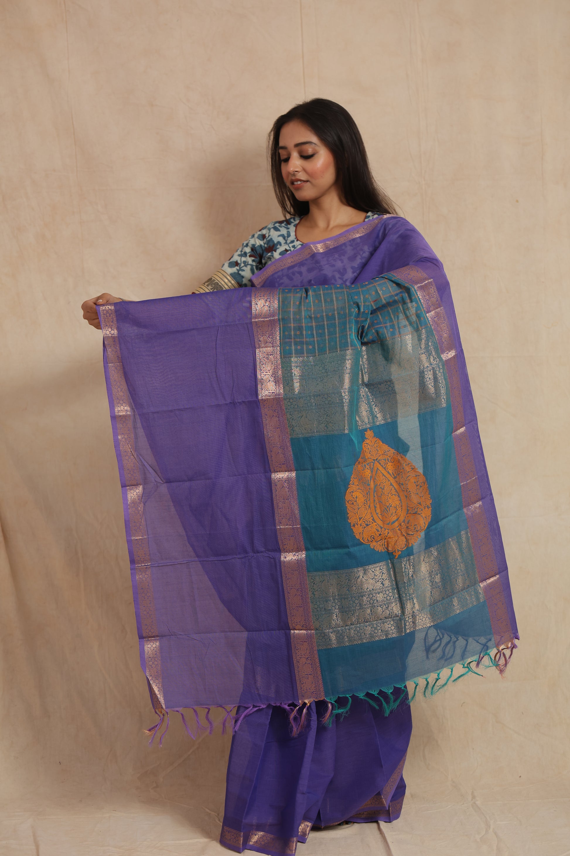 Close-up of royal purple Kanchipuram cotton saree with zari woven border