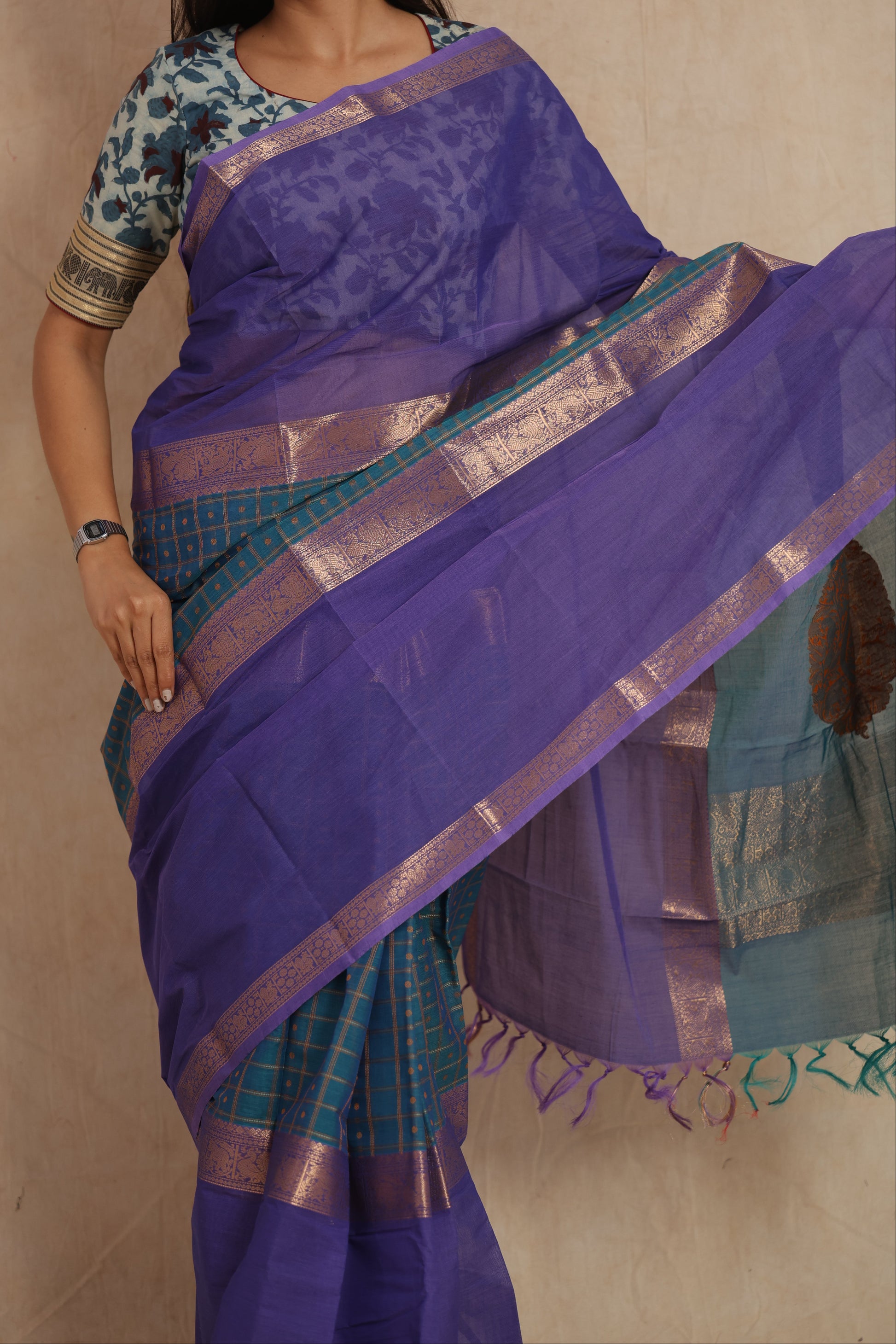 Close-up of royal purple Kanchipuram cotton saree with zari woven border