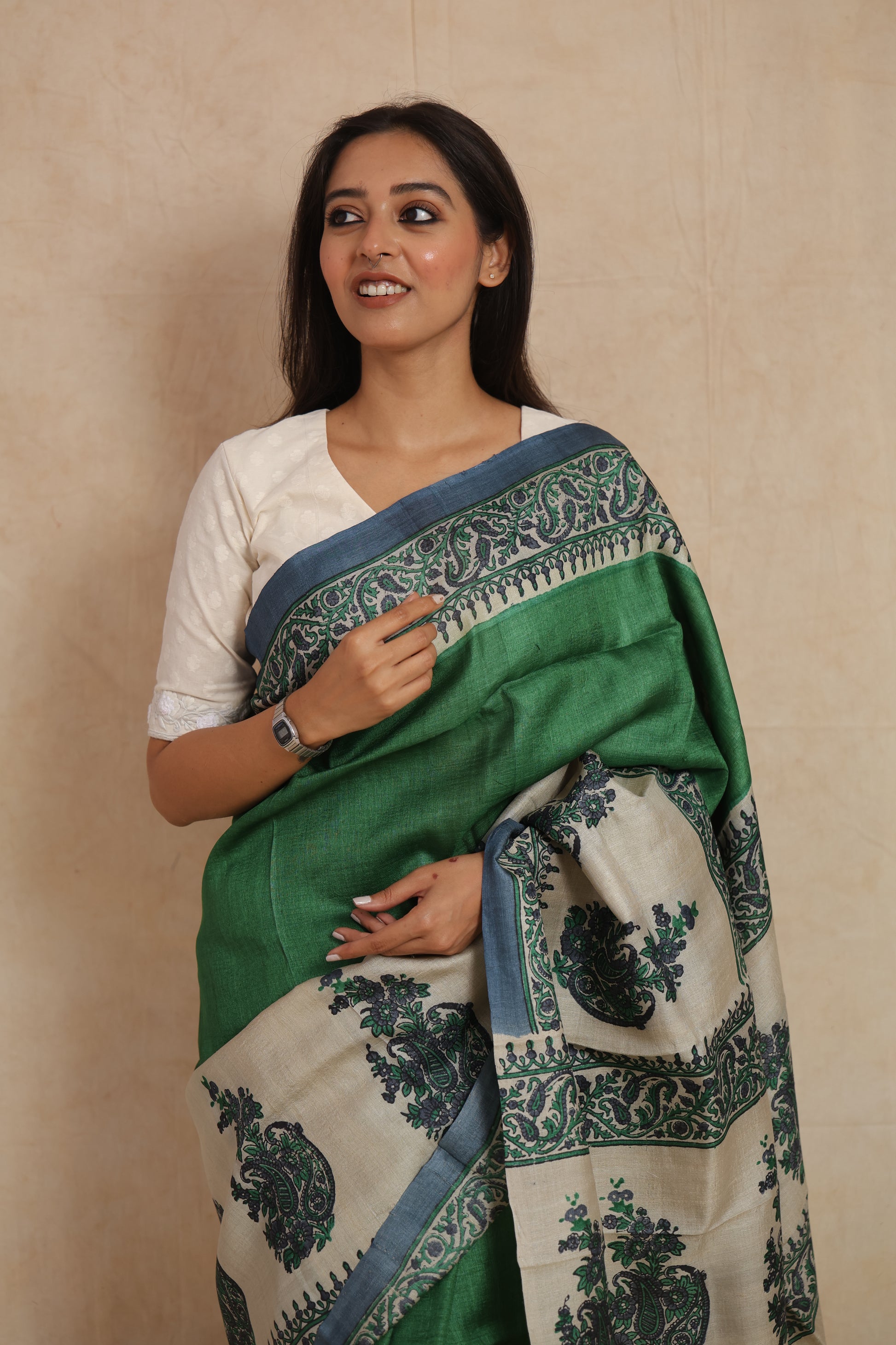 Close-up of printed paisley border and floral detailing on Tussar silk saree