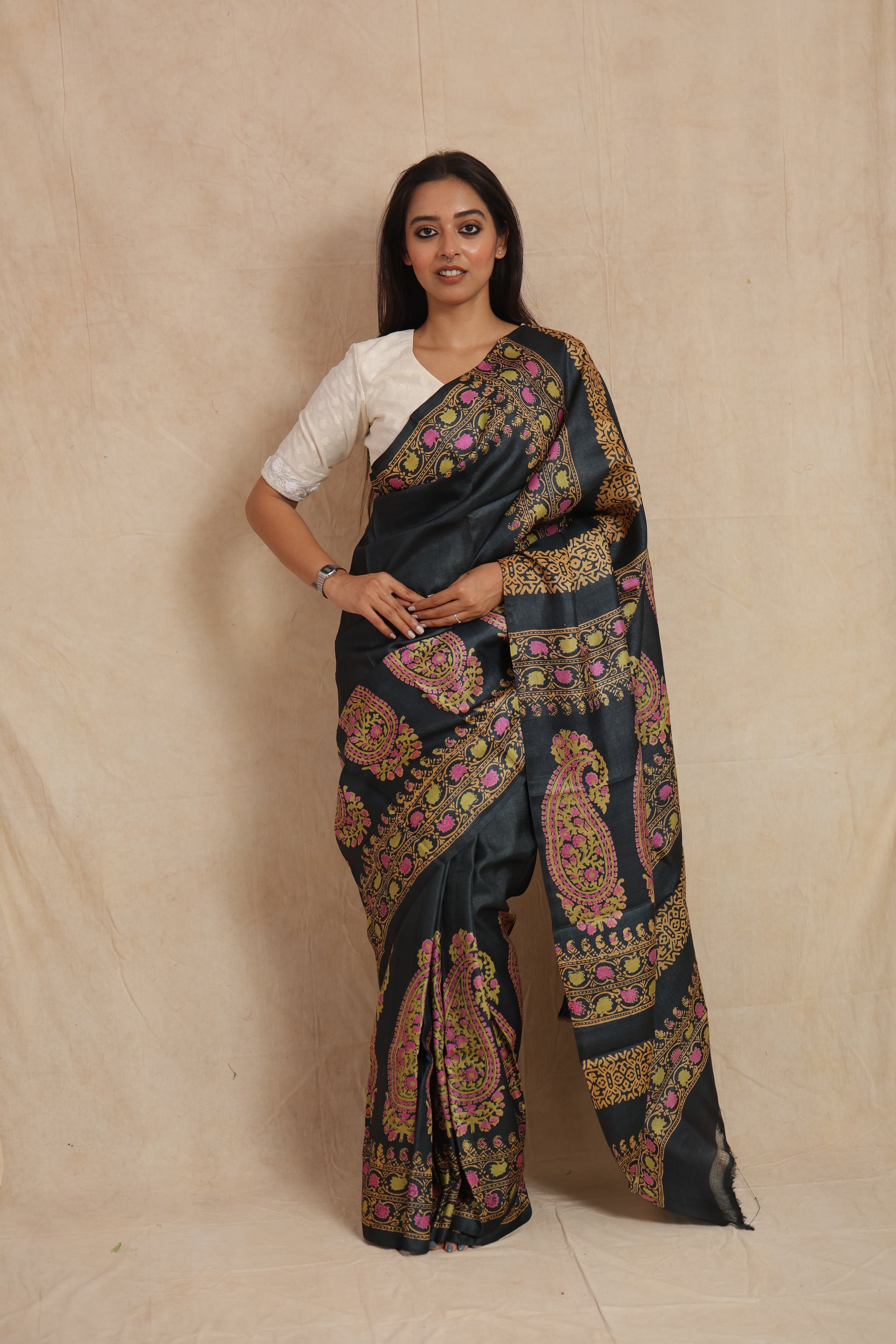 Front view of midnight black printed Tussar silk saree with paisley and floral motifs