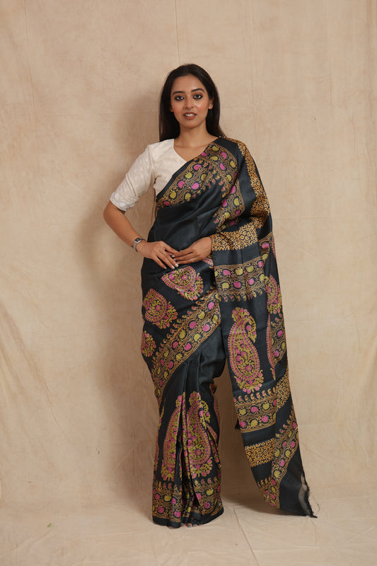Front view of midnight black printed Tussar silk saree with paisley and floral motifs