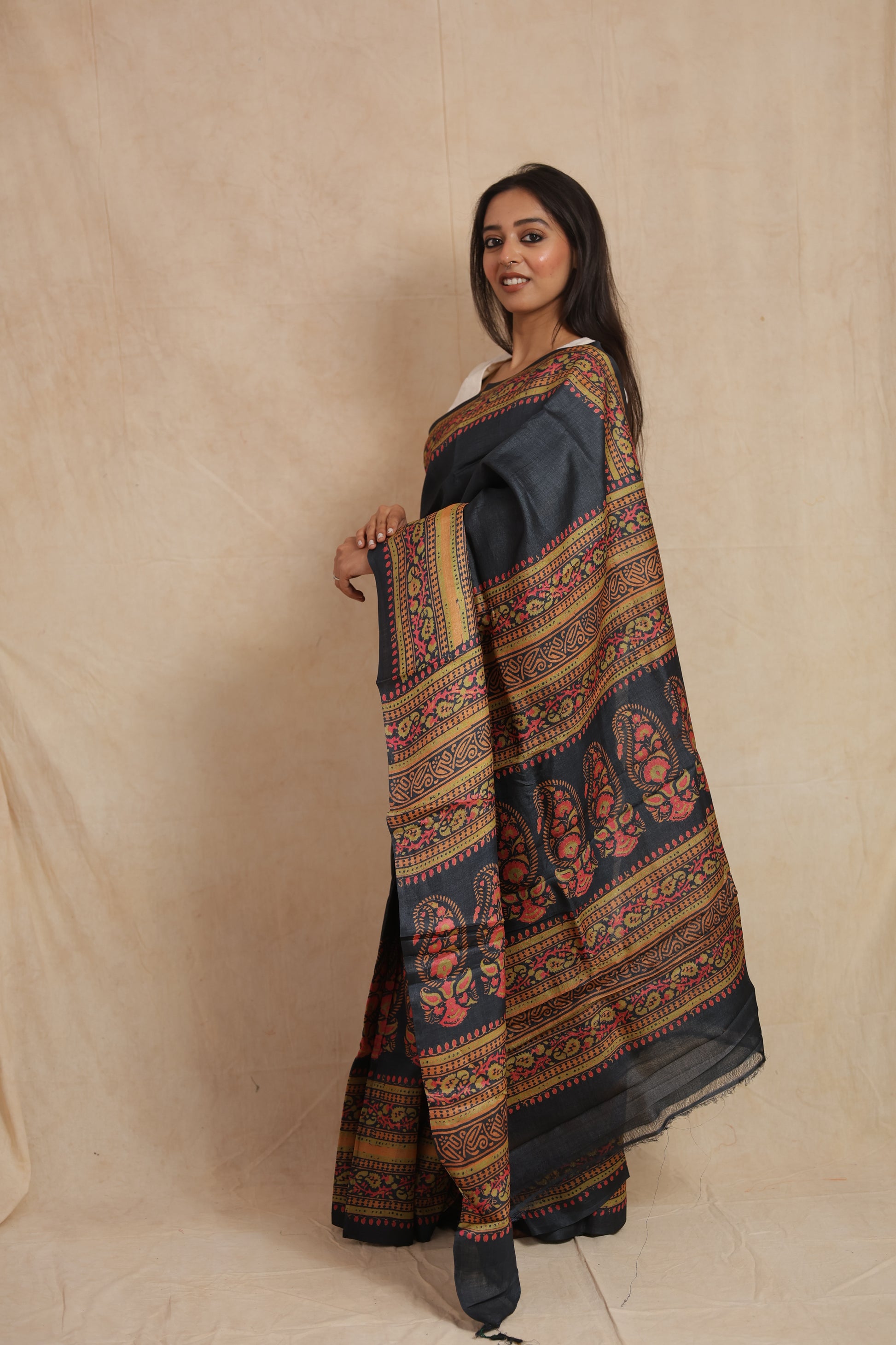Side profile of handcrafted Batik Tussar silk saree with intricate border motifs