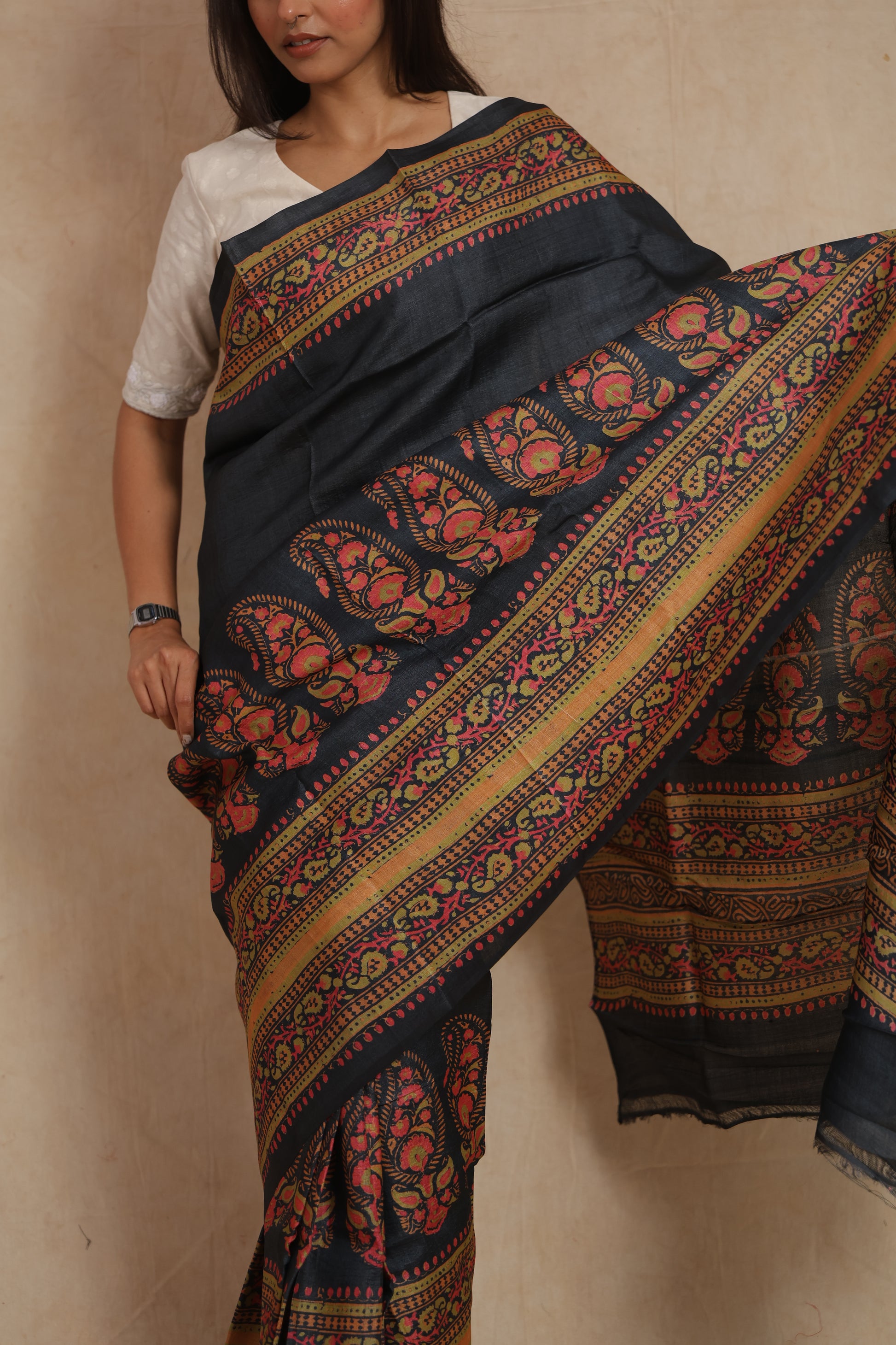 Detailed view of floral paisley Batik artwork on midnight zed black Tussar silk saree